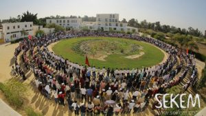 A lot of people in a circle with 3 rows in Sekem, Egypt
